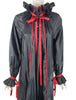 close view of black and red nylon opera coat